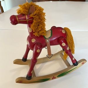 Wooden rocking horse, red with gold gold markings, 8.50”L, 9”T, Taiwan.